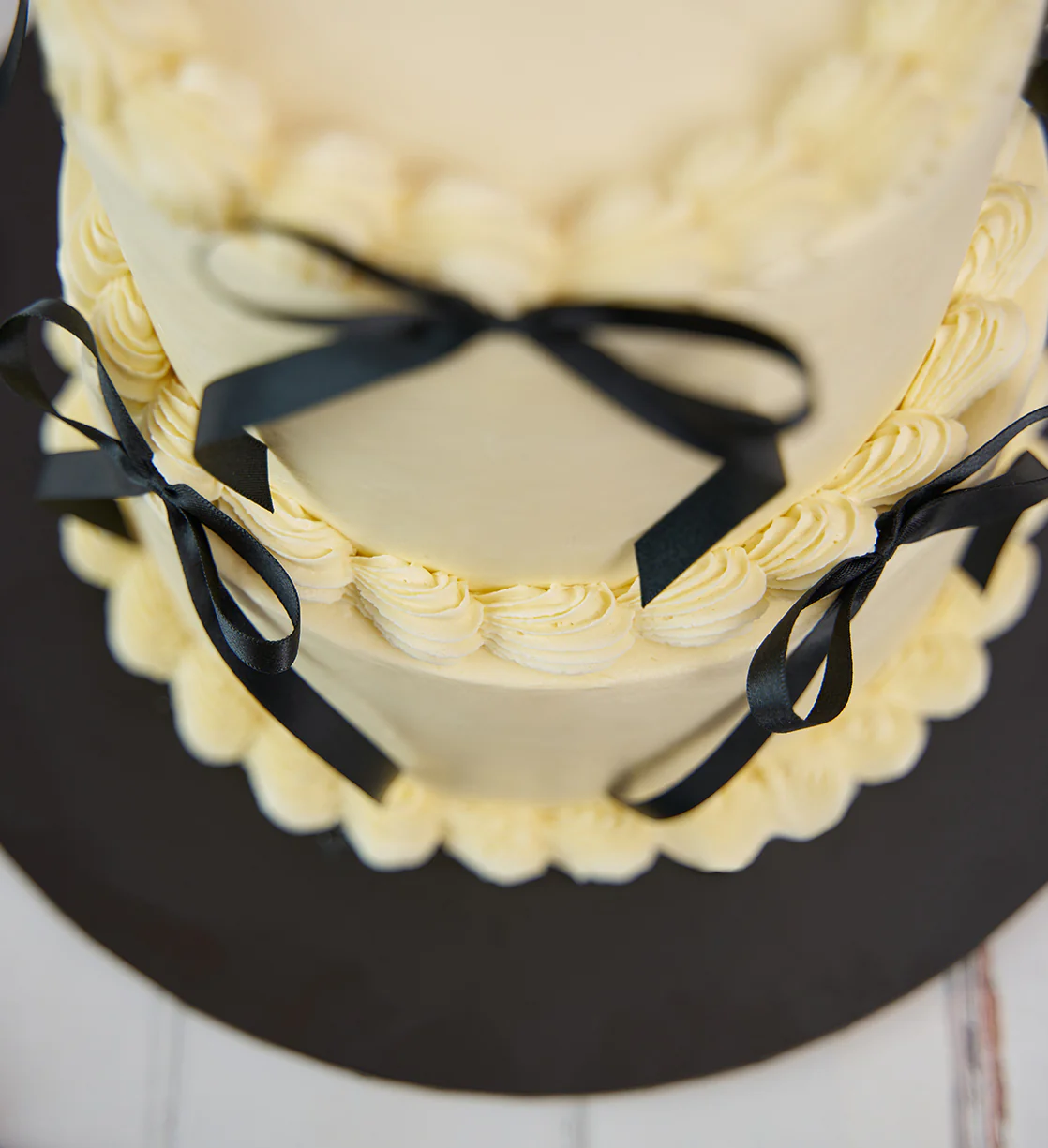 White and Black Mini Two Tier Ribbons and Ruffles Cake - Image 5