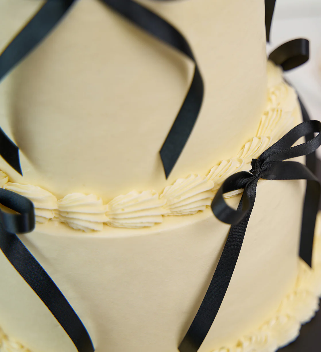 White and Black Mini Two Tier Ribbons and Ruffles Cake - Image 6