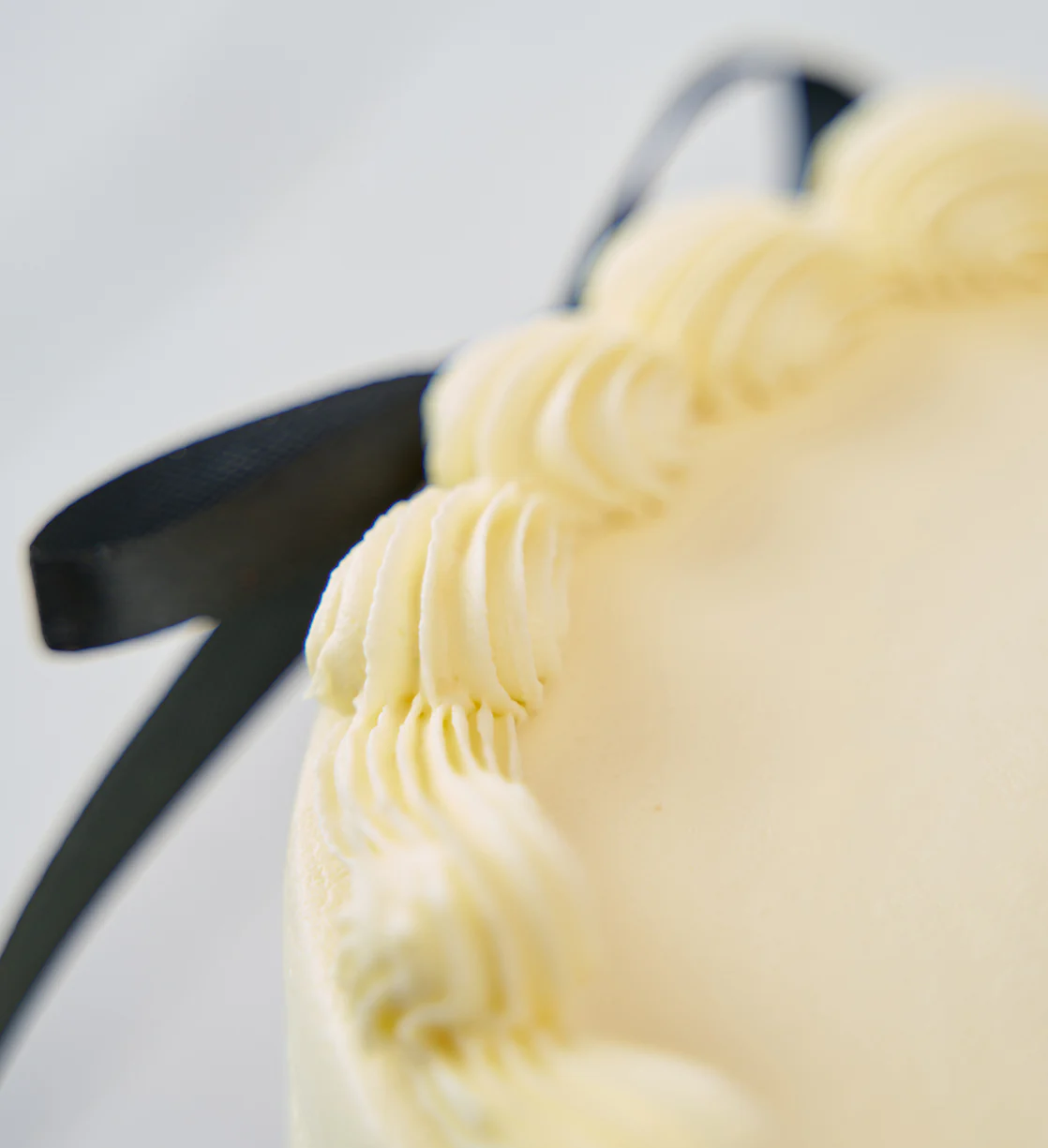 White and Black Ribbons and Ruffles Cake - Image 6