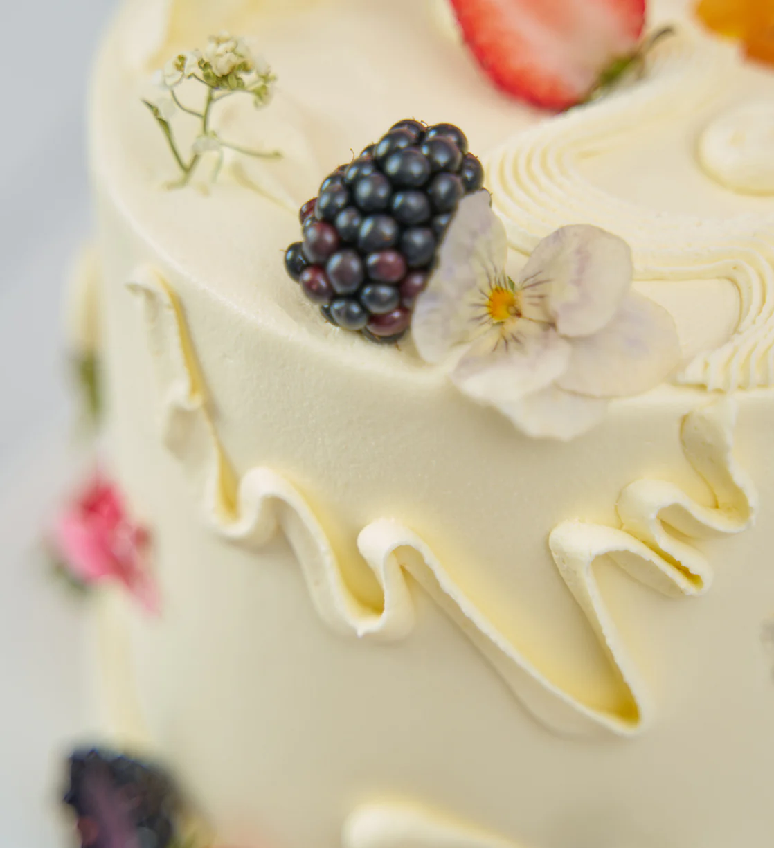White Fruity and Floral Cake - Image 5